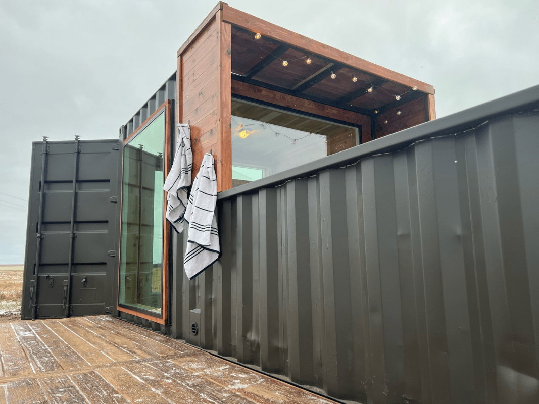 A single-story home made of containers