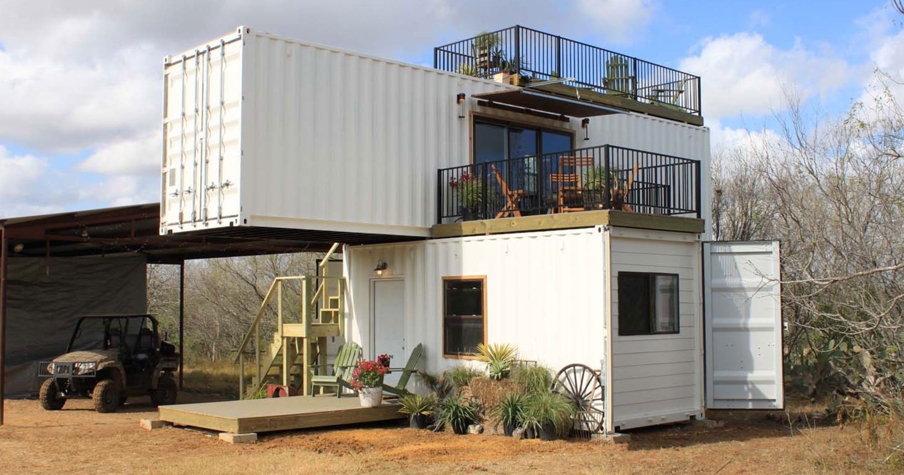 two story farmhouse made of container with a mountain view